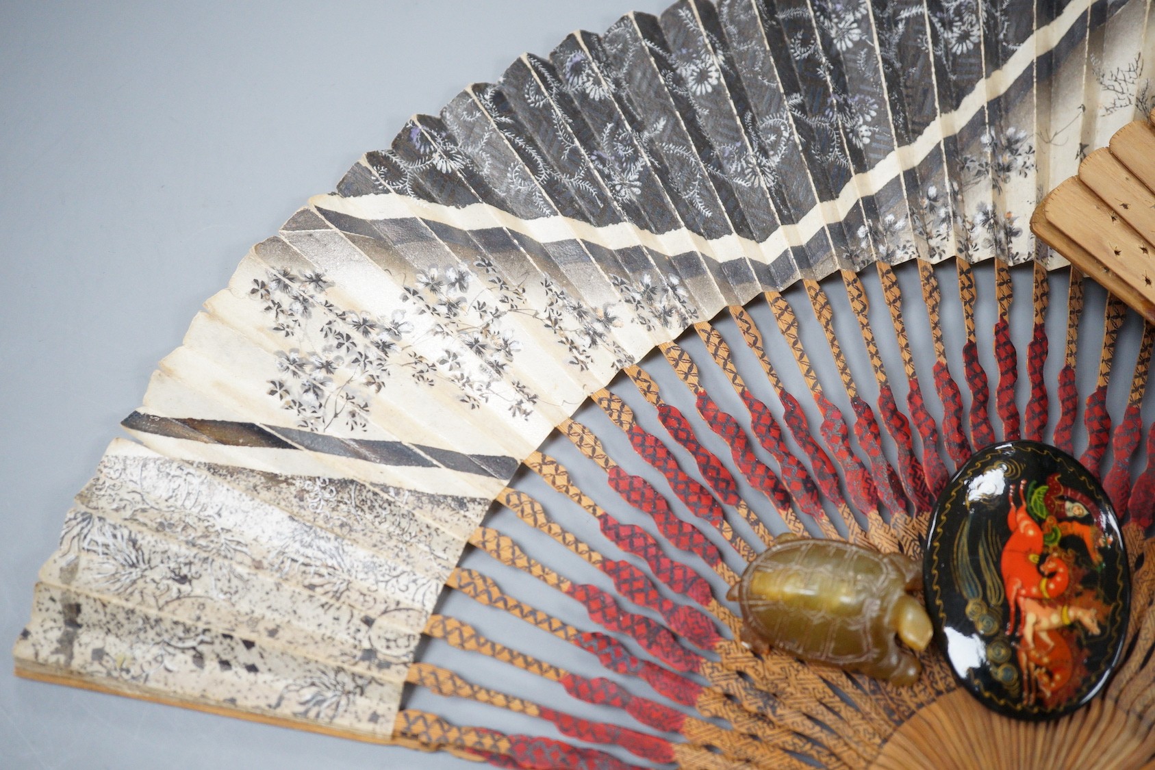 A Japanese hardwood cicada netsuke, two hardstone pieces and sundries